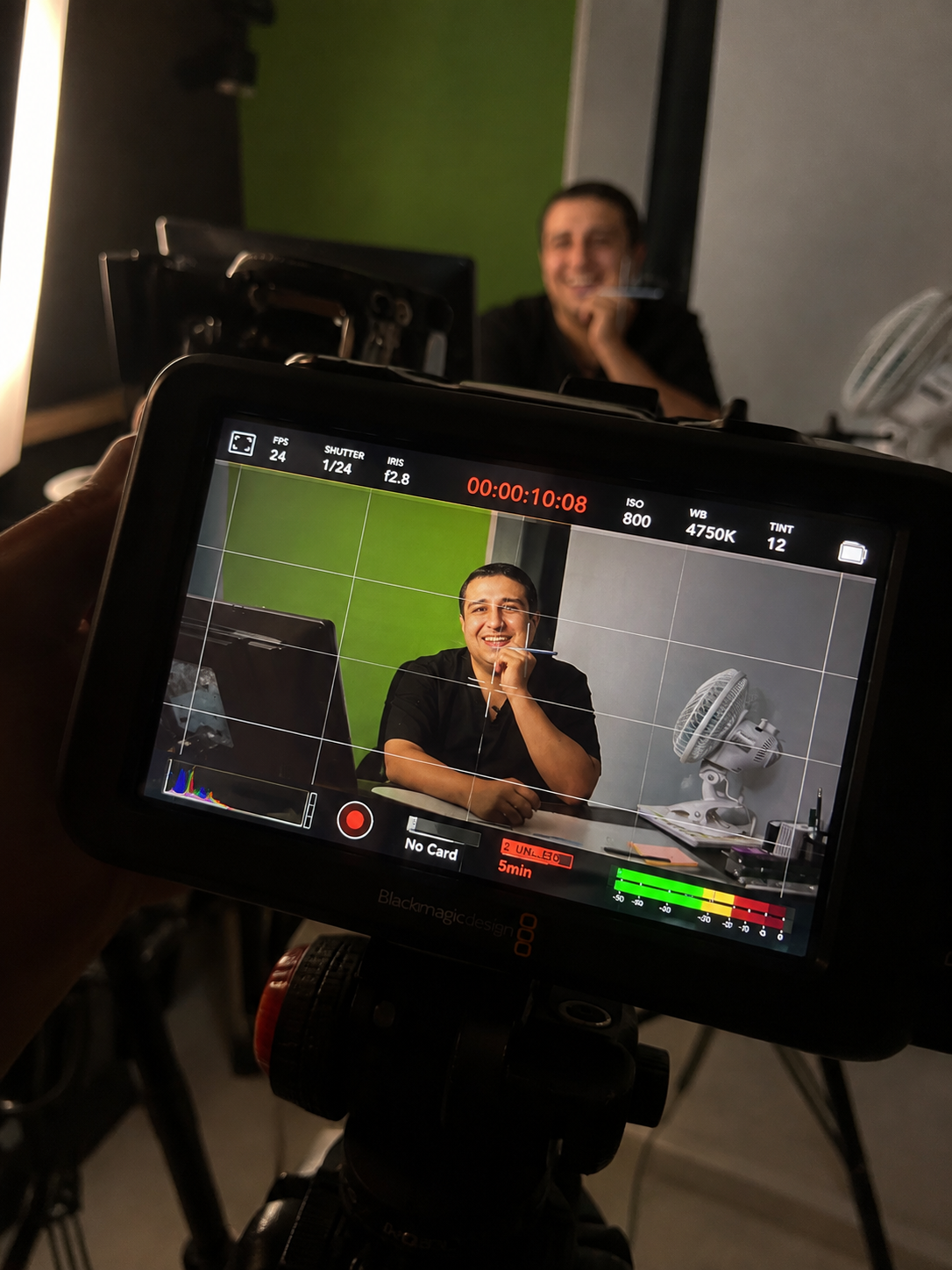Behind the scenes — monitor on a green-screen set